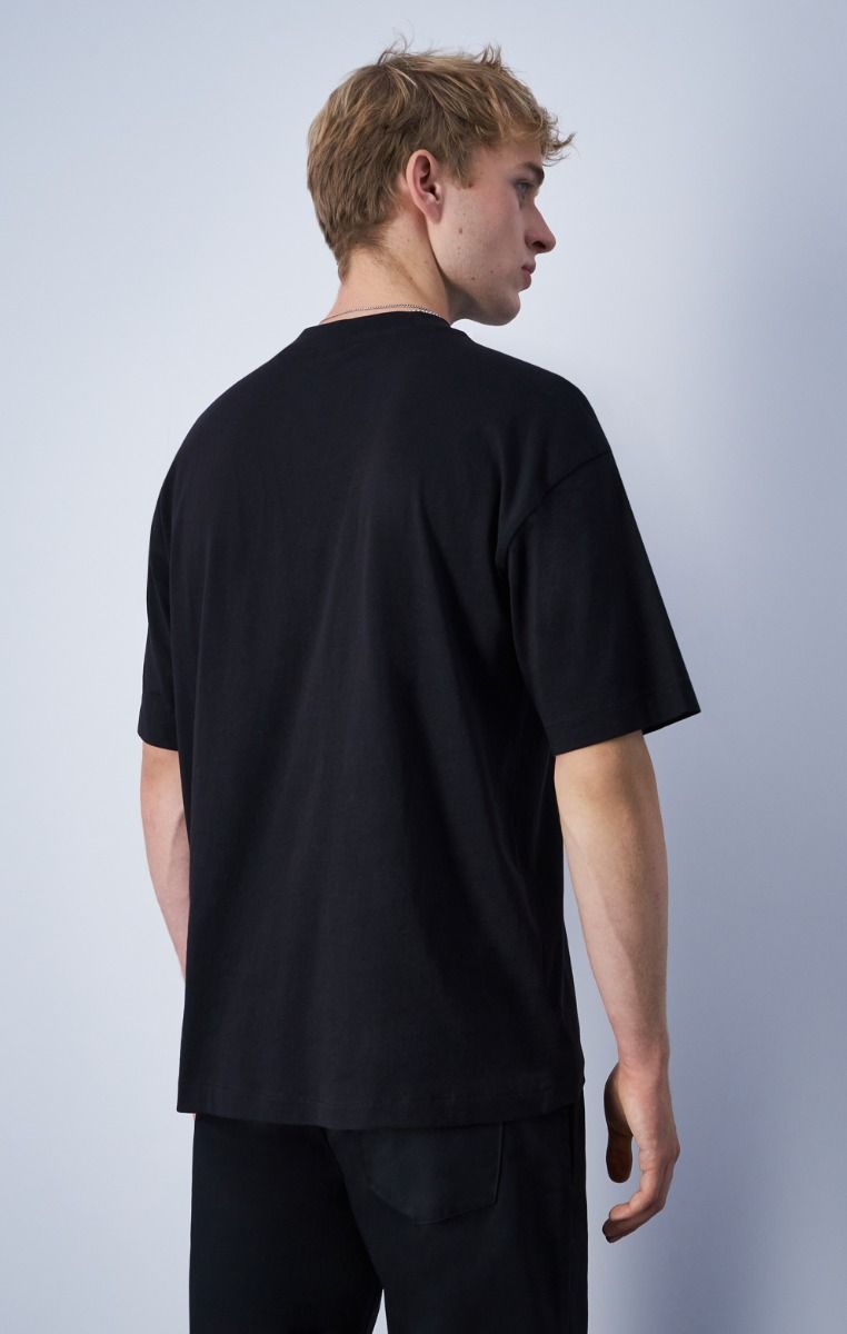 CHAMPION CREWNECK T-SHIRT เสื้อยืดทีเชิ๊ต ผู้ชาย 219856-KK003 Black - 1 Supersports Thailand